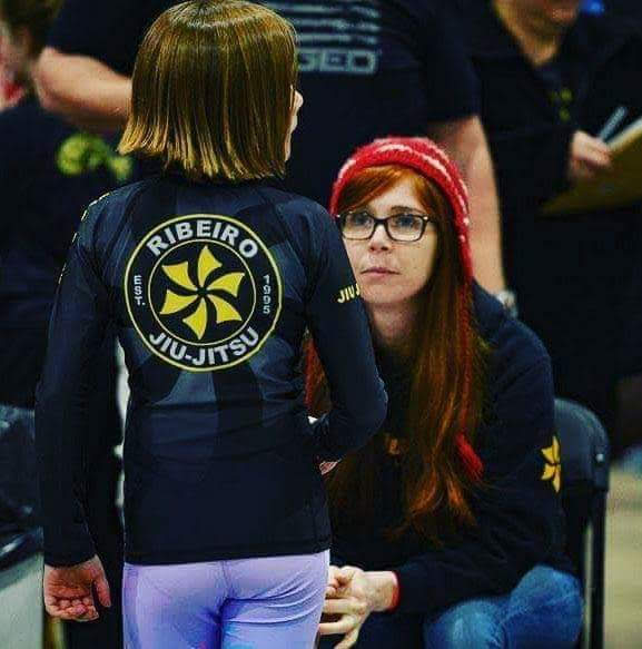 Professor Hannah working with students at a local Denver competition
